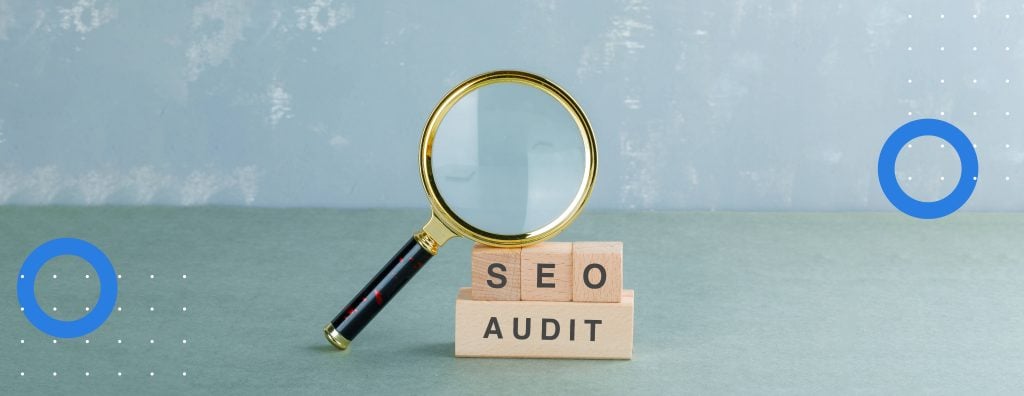 A magnifying glass that emphasises the significance of doing an SEO audit